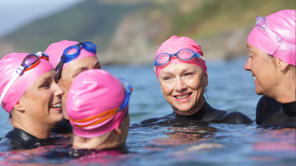 Wild swimming women sea pink caps